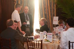 Don Jewell visits the Exelis table at the GPS World Leadership Dinner.