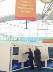 Exhibitors checking out the National Geospatial-Intelligence Agency's Latin American physical and political geography map.