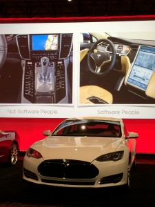 Jeff Lawson, CEO of Twilio, comparing "hardware people" and "software people," says Tesla's Model S interior forgoes extra buttons for useful, adaptable software.
