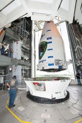 This one’s in orbit now. Photo shows the nose cone containing GPS IIF-10 being lowered into position atop the launch vehicle, inside the rocket gantry at Cape Canaveral. 