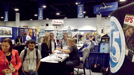 Crowds gather at the GPS World booth at ION GNSS+ 2014.