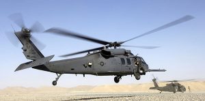 An HH-60 Pave Hawk helicopter lands in Afghanistan; a UH-60 Blackhawk is in the background. (Photo: (U.S. Air Force photo/Senior Airman Brian Ferguson)