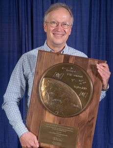 The Institute of Navigation presents Dr. Oliver Montenbruck with prestigious Johannes Kepler Award at the ION GNSS+ 2018 Conference. (Photo: ION)